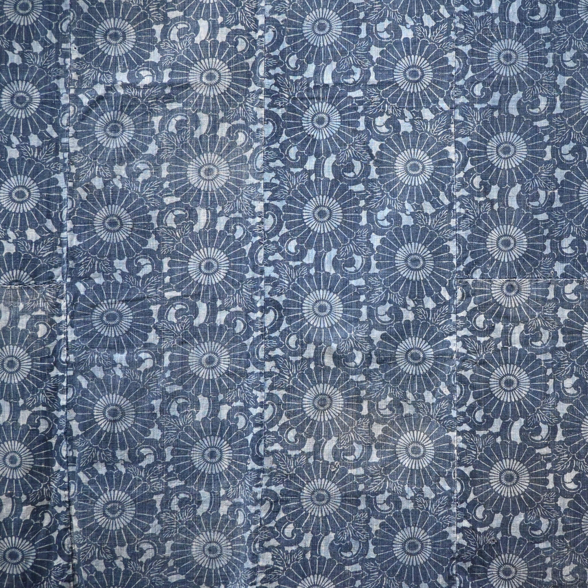 Vintage four-panel indigo katazome dyed cotton futon cover with chrysanthemum arabesque motif.