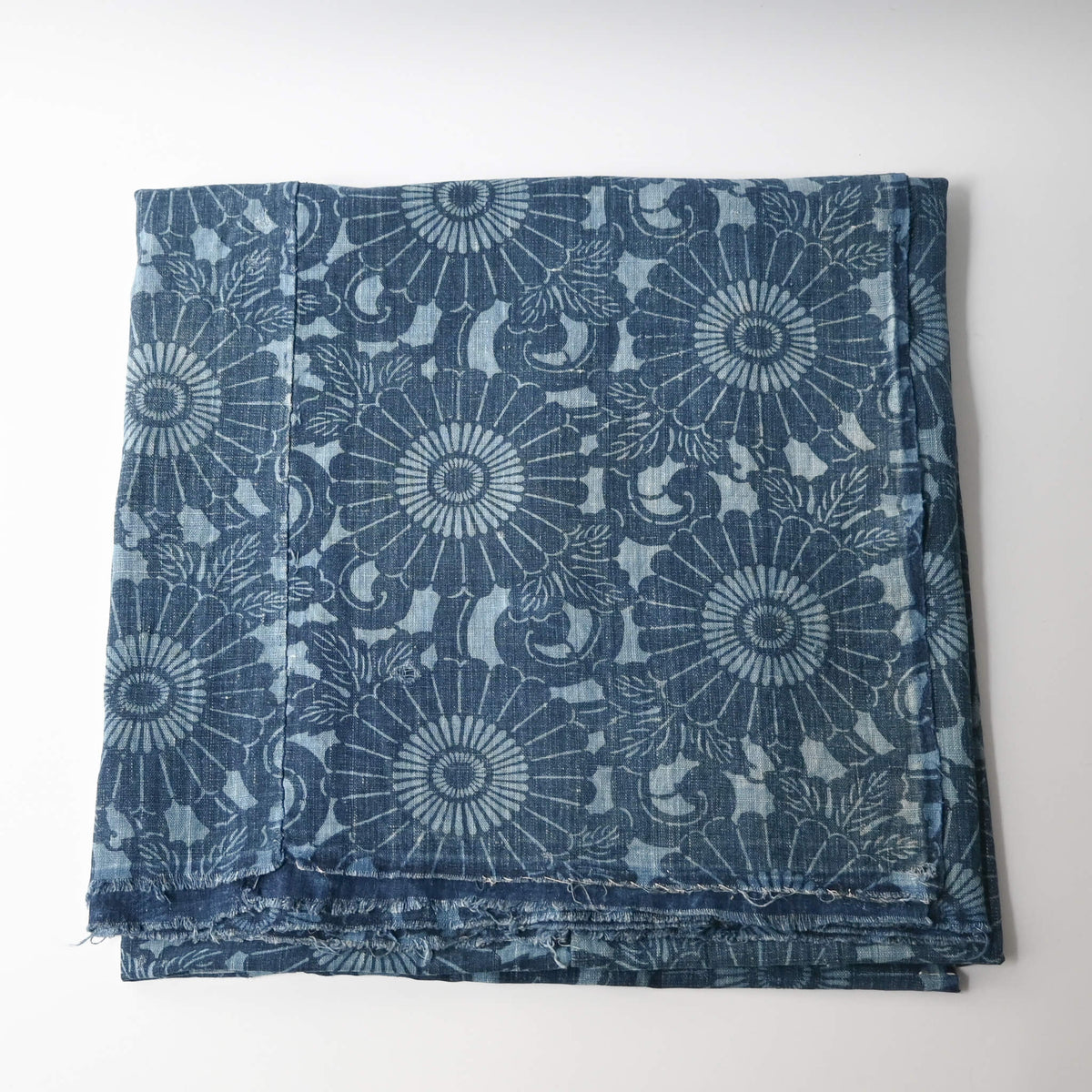 Vintage four-panel indigo katazome dyed cotton futon cover with chrysanthemum arabesque motif.