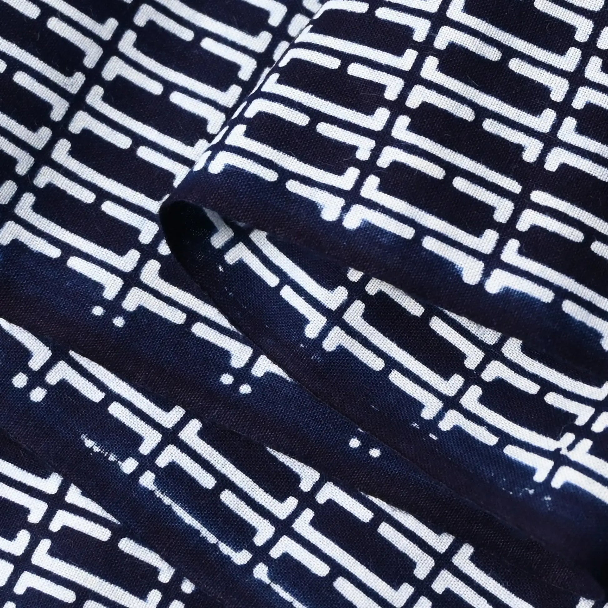 Close-up view of vintage traditional Japanese men's yukata cotton fabric sold by the metre.