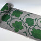 Vintage Japanese grey tsumugi silk kimono fabric with deep green large-scale floral design, sold by the metre.