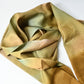 Recycled green silk obiage with gold plum blossom.