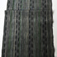 Full view of vintage tsumugi silk kimono fabric with olive green, charcoal and black stripes, and kasuri accents.