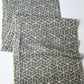 Full view of vintage grey tsumugi kimono silk with geometric pattern.