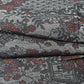 Detailed view of vintage grey tsumugi silk kimono fabric, garden with flower design.