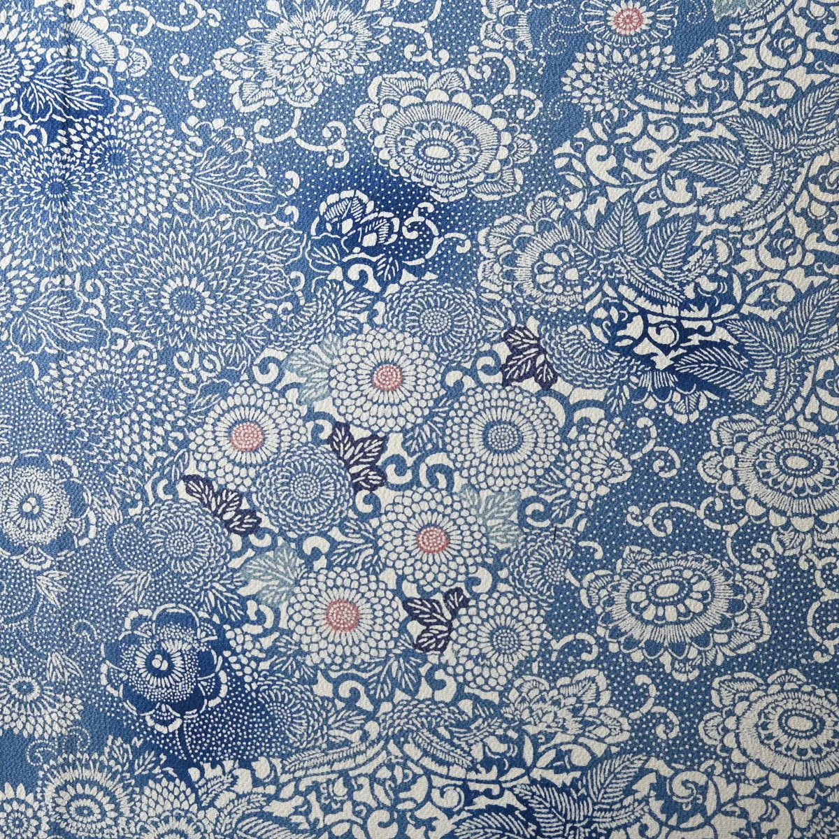 Vintage heavy silk crepe chirimen kimono fabric, katazome dyed chrysanthemum in soft blue.