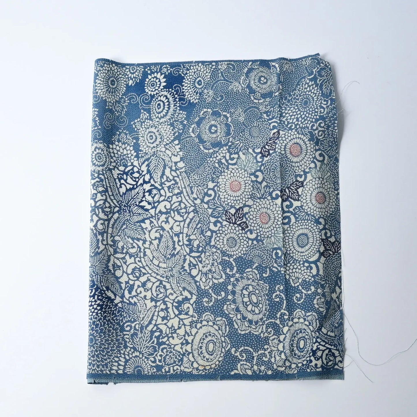 Vintage heavy silk crepe chirimen kimono fabric, katazome dyed chrysanthemum in soft blue.