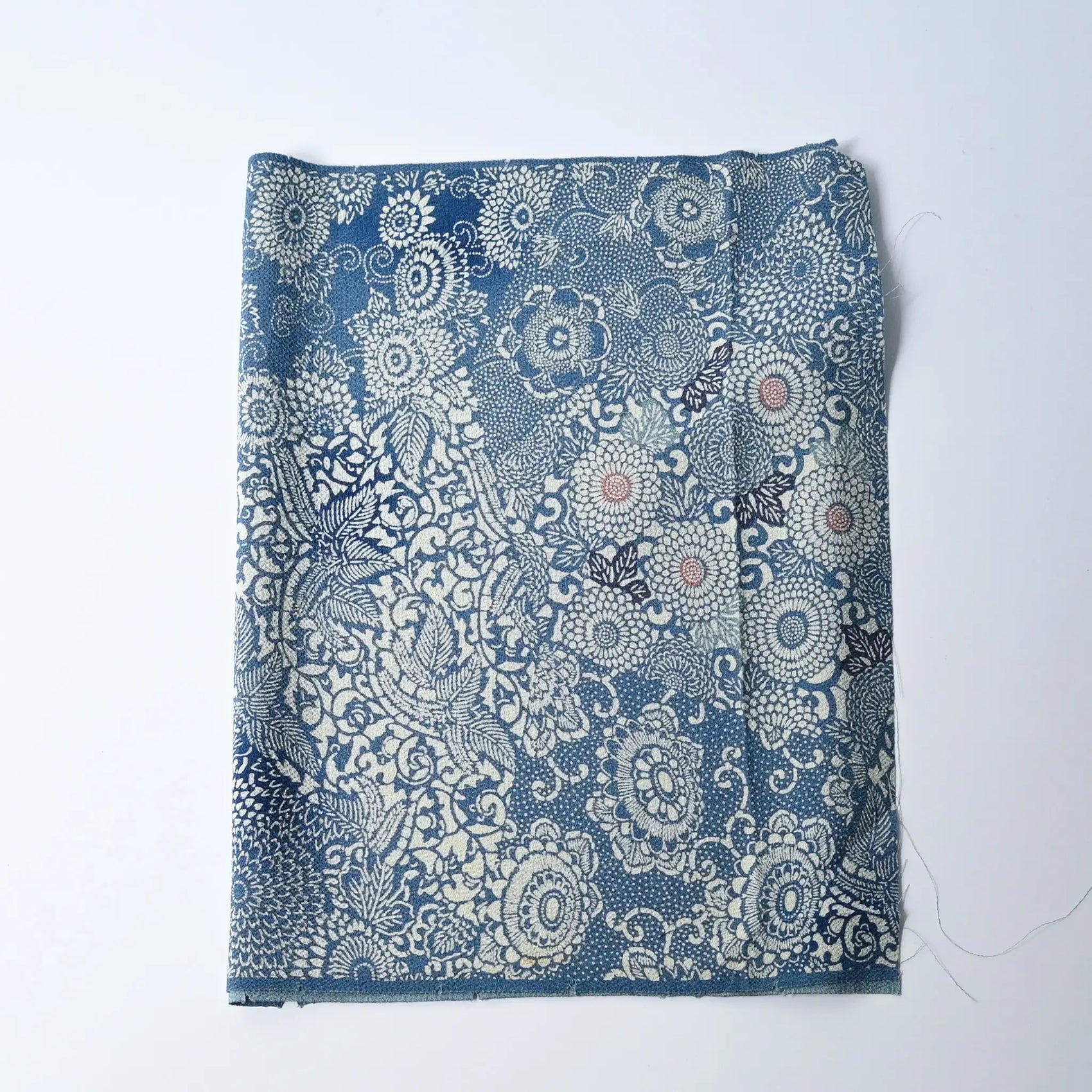 Vintage heavy silk crepe chirimen kimono fabric, katazome dyed chrysanthemum in soft blue.