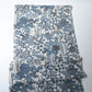full view of vintage heavy silk crepe Chirimen kimono fabric with indigo floral pattern.