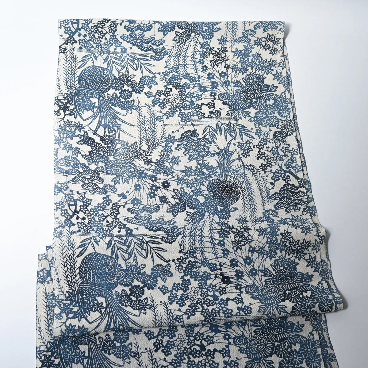full view of vintage heavy silk crepe Chirimen kimono fabric with indigo floral pattern.