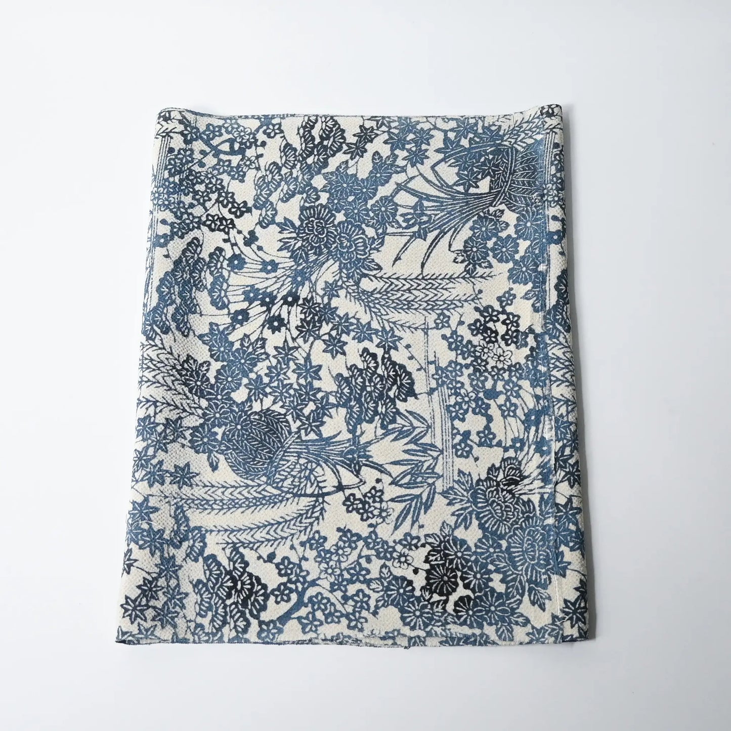 Vintage heavy silk crepe Chirimen kimono fabric with indigo floral pattern.