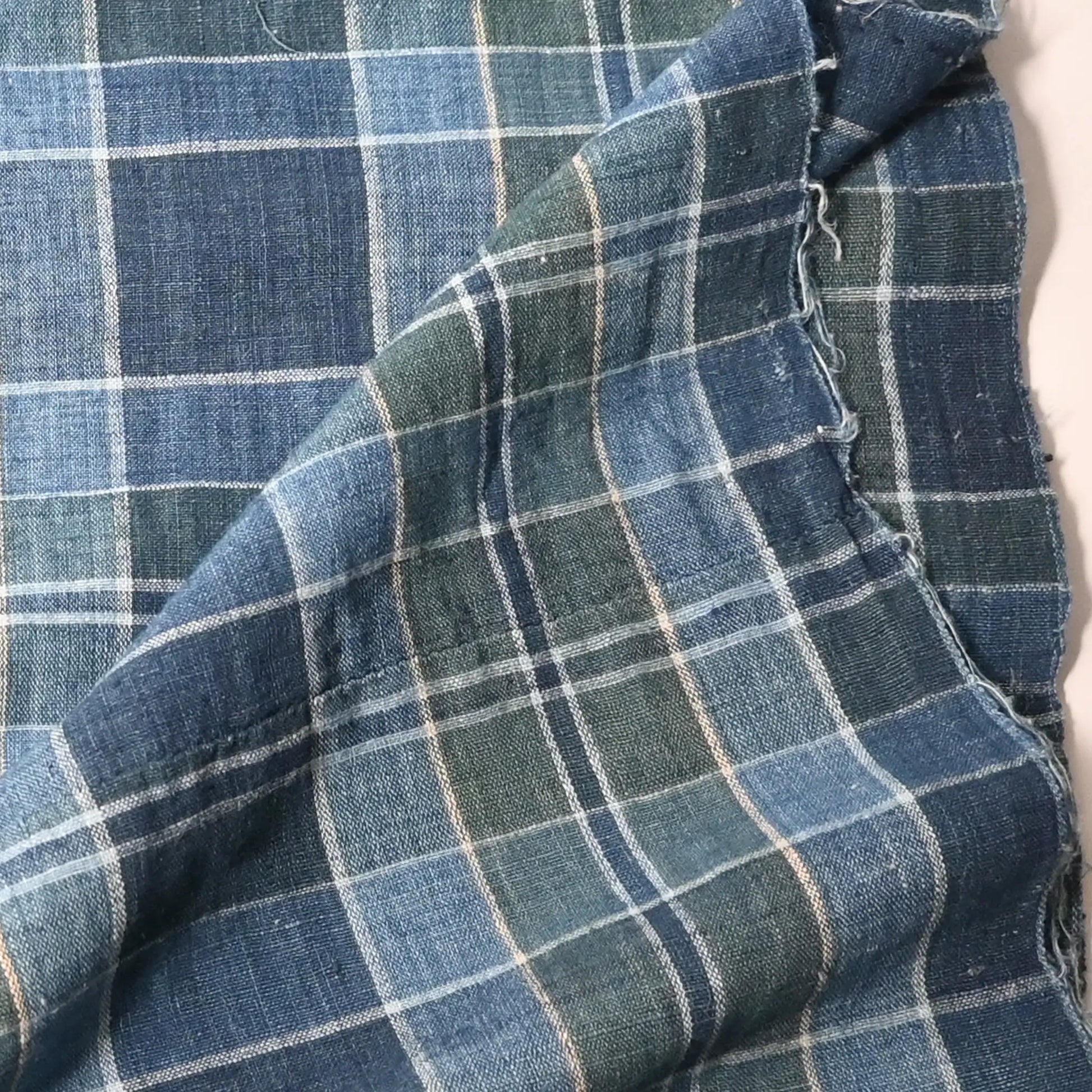 Detailed view of vintage Japanese soft indigo and green tartan check cotton futon cover from the mid-20th century.