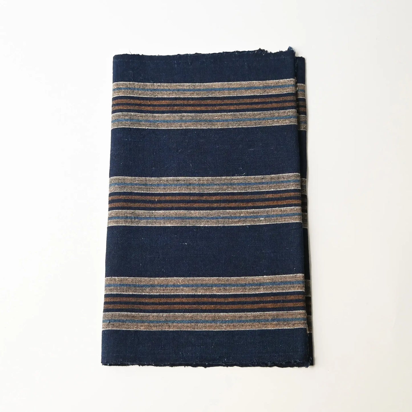 Vintage Japanese indigo and warm brown stripe cotton piece from a futon cover, early 20th Century.