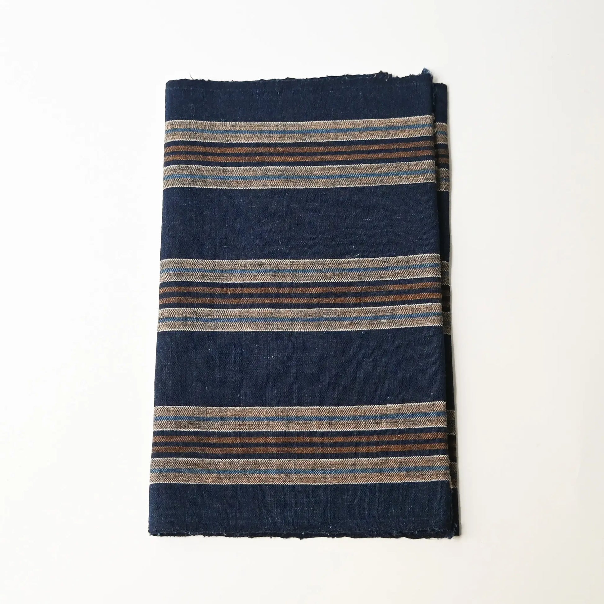 Vintage Japanese indigo and warm brown stripe cotton piece from a futon cover, early 20th Century.