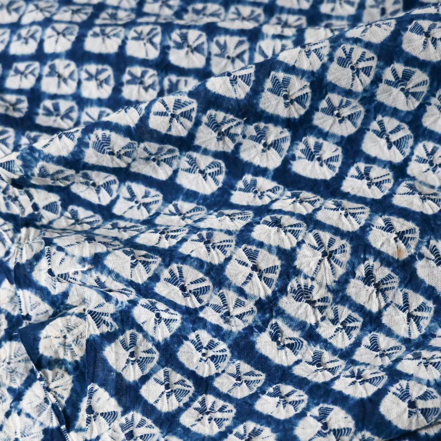 Close-up view of vintage handcrafted Arimatsu shibori cotton piece from a summer kimono yukata.