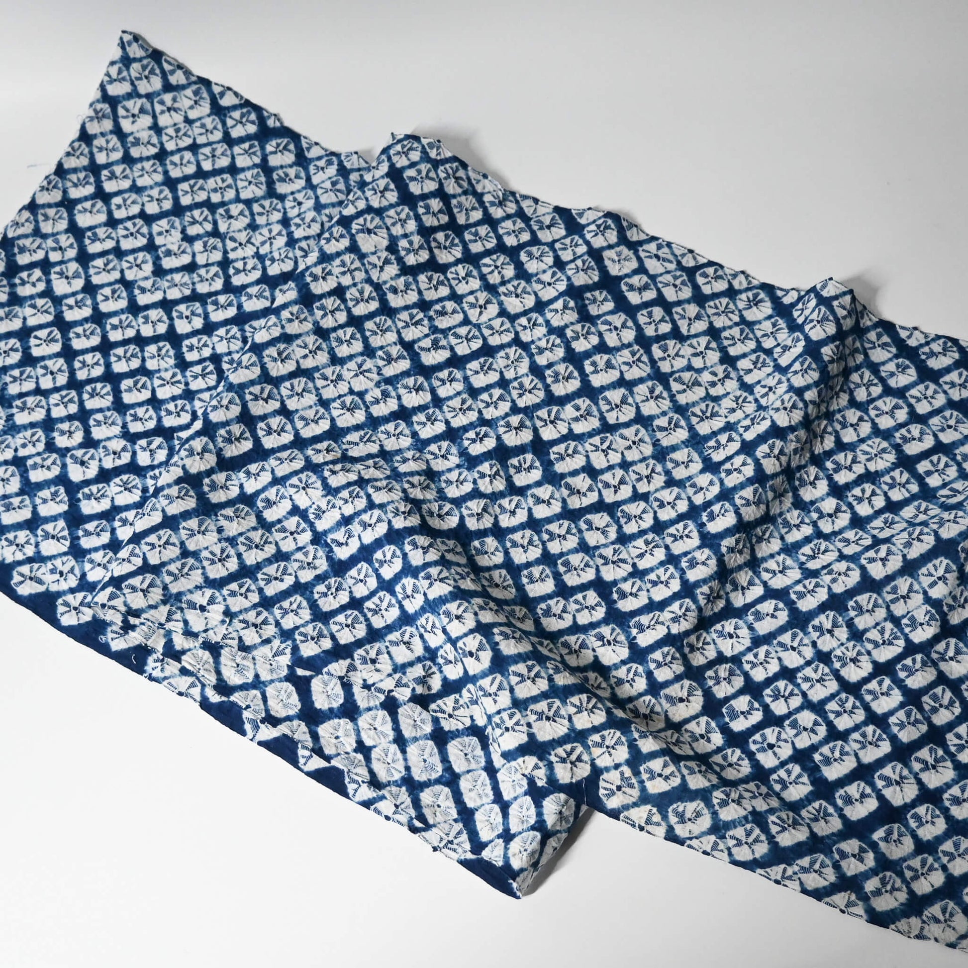 Full view of vintage handcrafted Arimatsu shibori cotton piece from a summer kimono yukata.