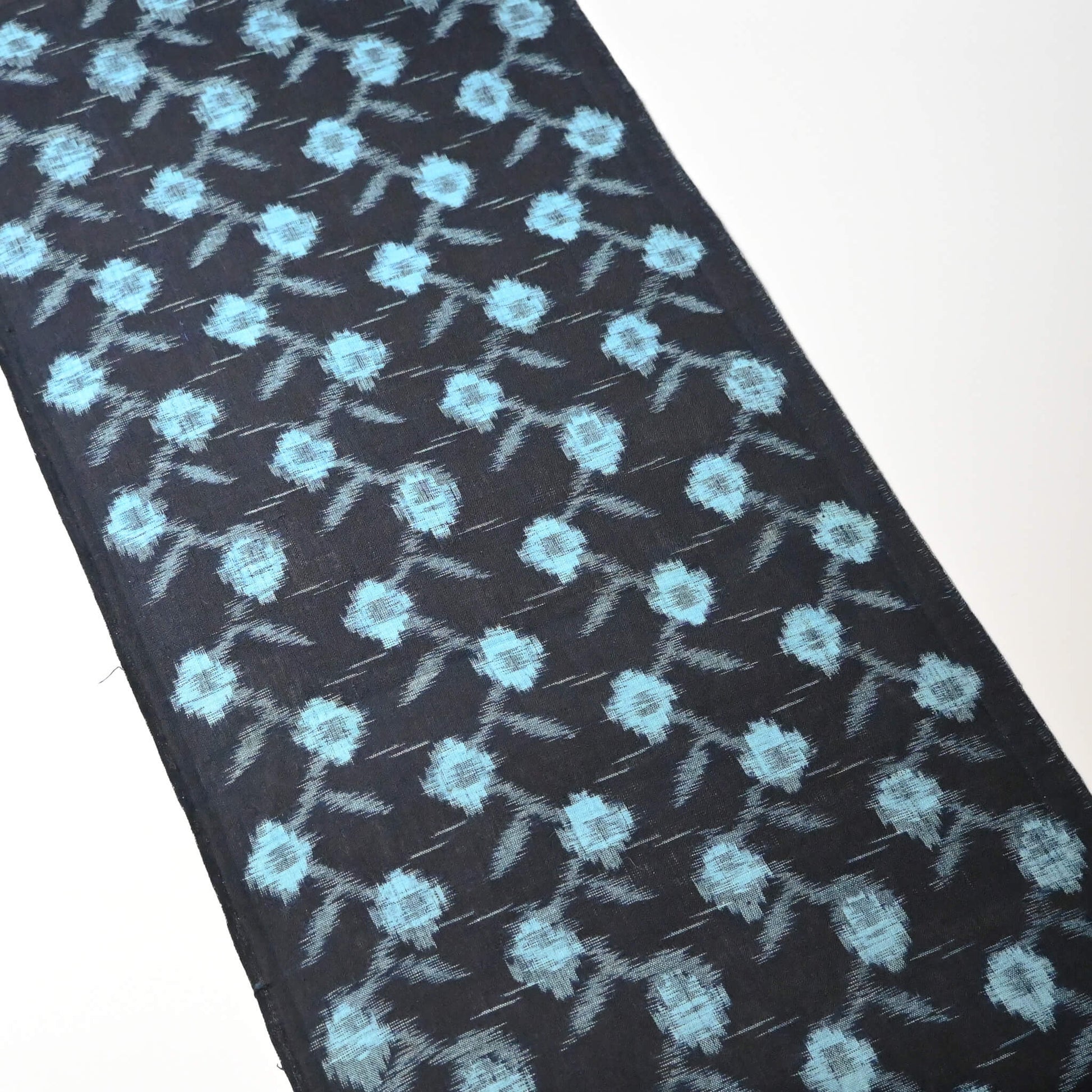 Full view of vintage indigo kasuri cotton kimono fabric piece.