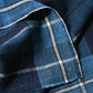 Close-up view of vintage Japanese indigo cotton futon cover panel with bold check pattern.