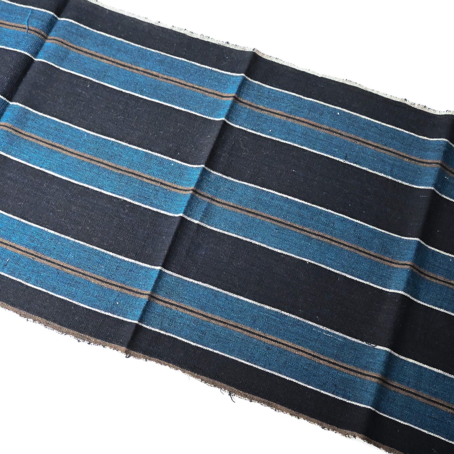 Full view of vintage indigo bold stripe cotton fabric piece, medium to heavy weight.