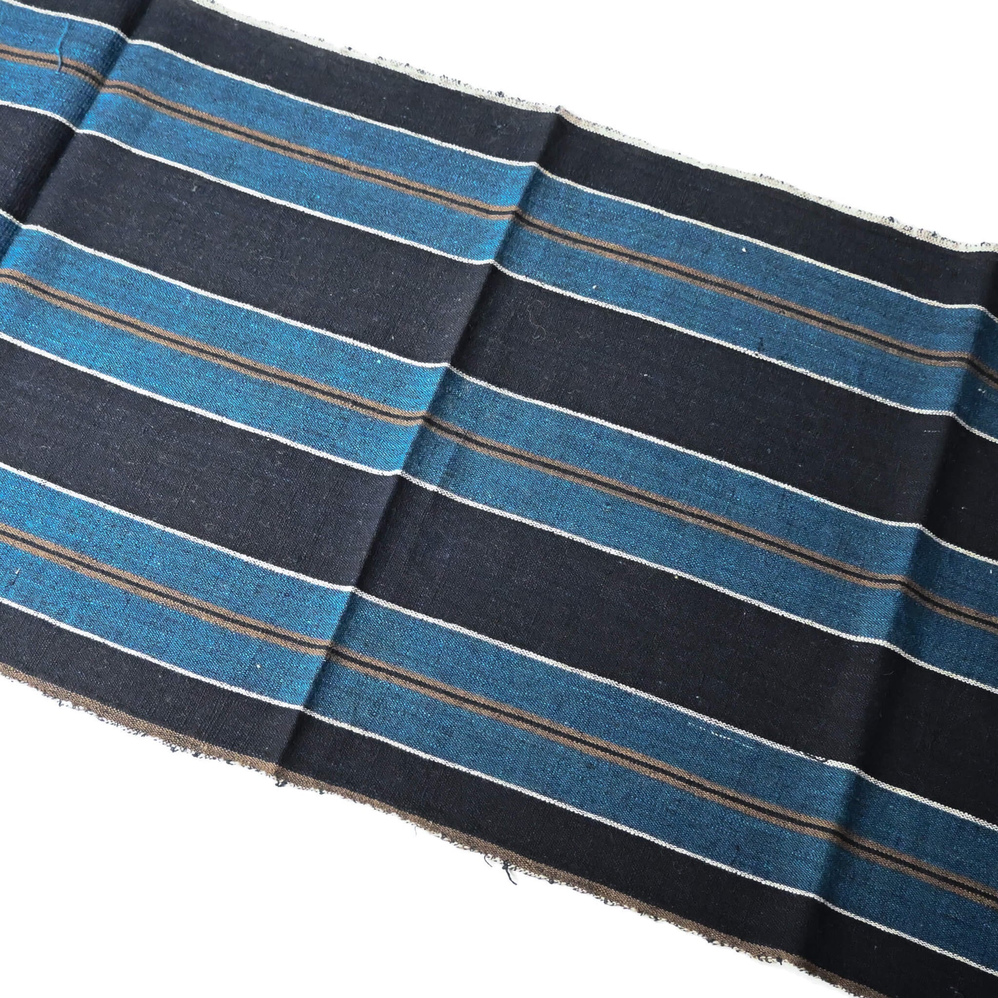 Full view of vintage indigo bold stripe cotton fabric piece, medium to heavy weight.
