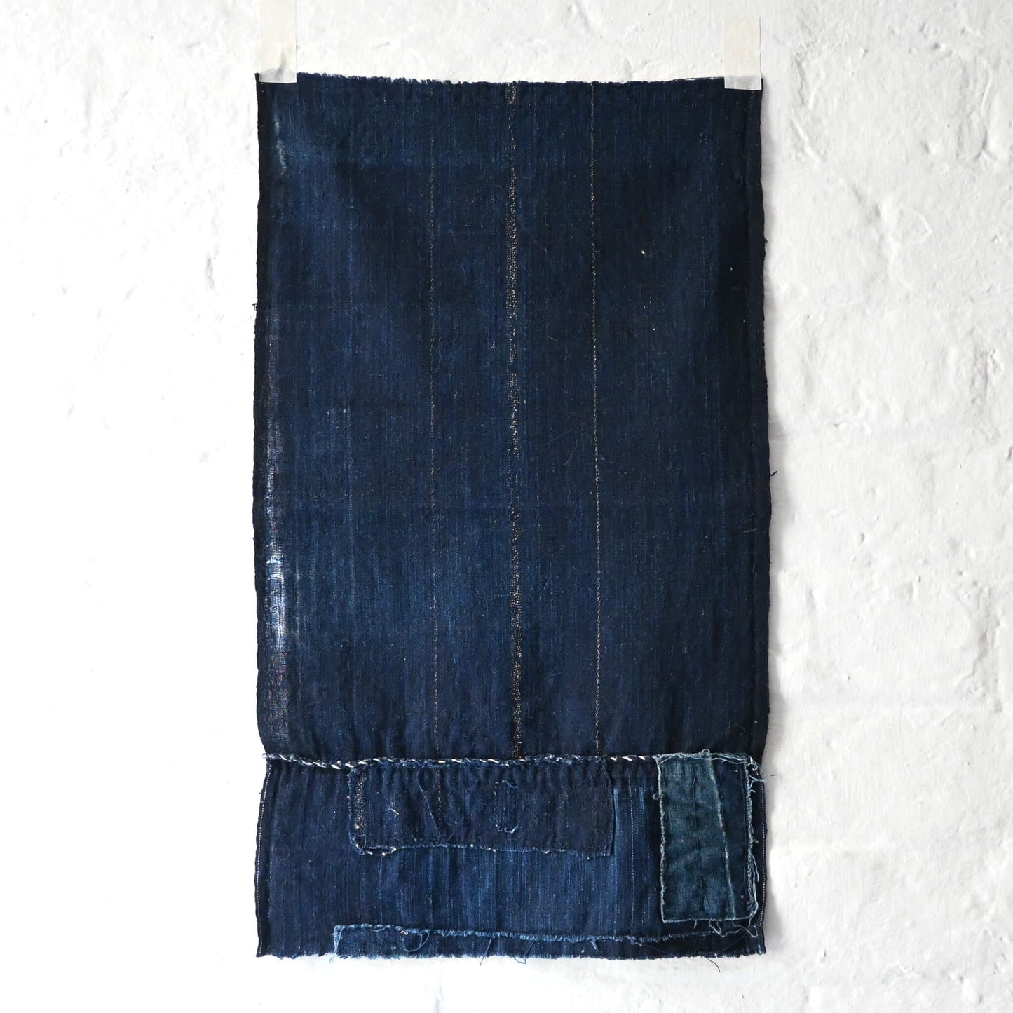 A fragment of Japanese  indigo boro piece from a futon cover.
