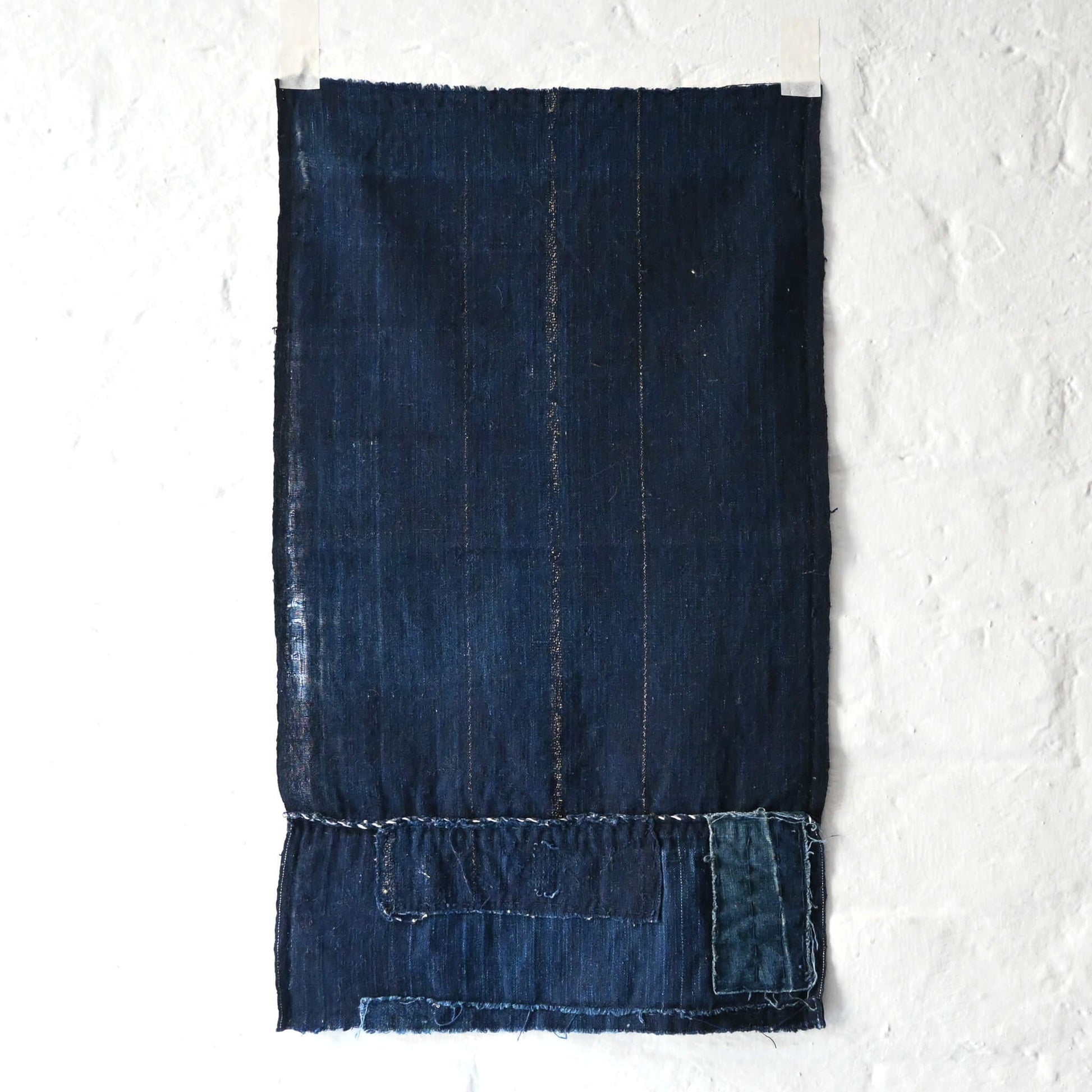 A fragment of Japanese  indigo boro piece from a futon cover.
