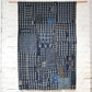 Full view of vintage Japanese indigo check cotton Boro futon cover with layers of mending.