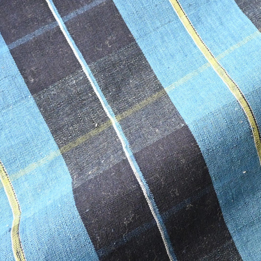 Detailed view of vintage Japanese hand loomed indigo check cotton piece, striking yet elegant pattern.