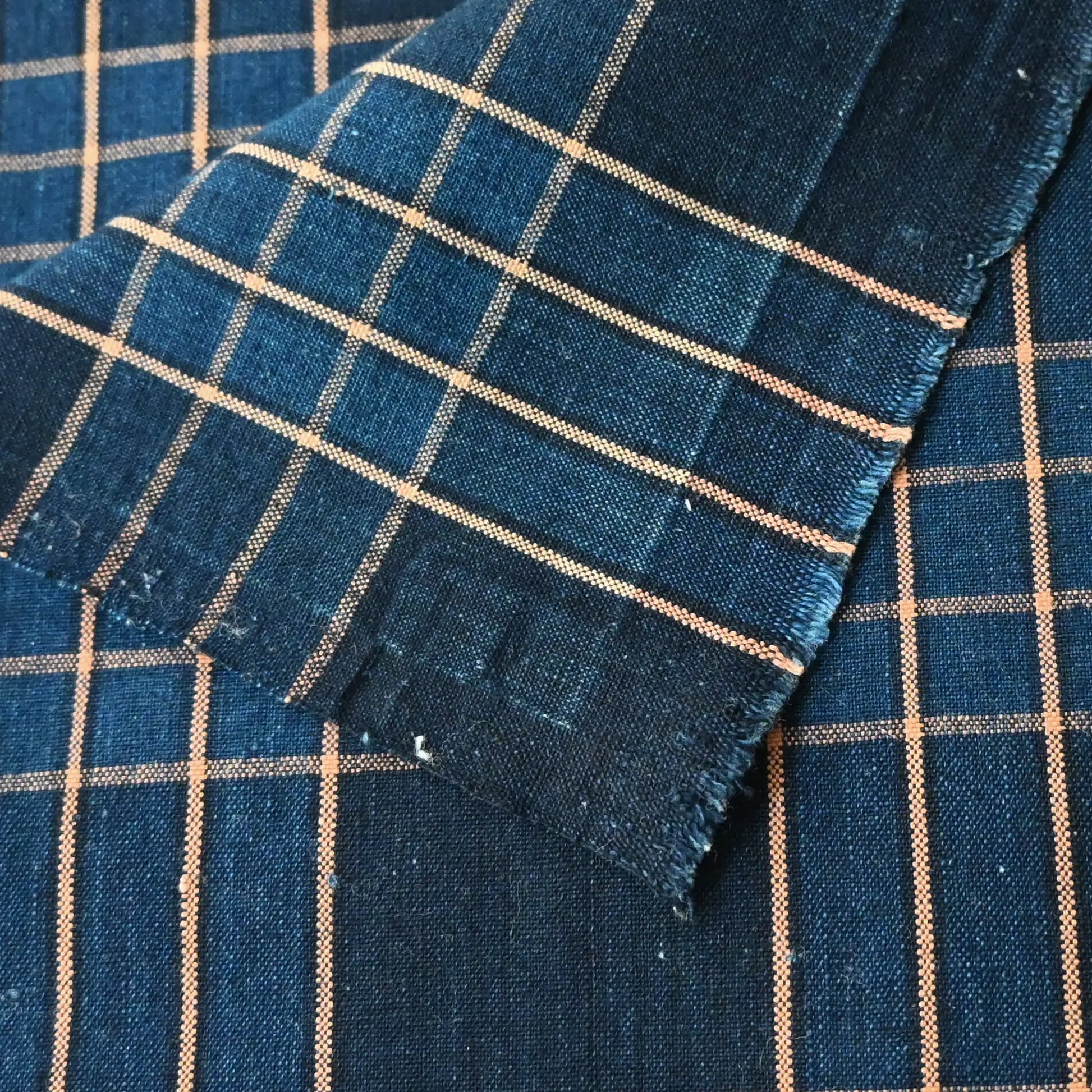 Close-up view of vintage Japanese indigo check cotton from a futon cover.
