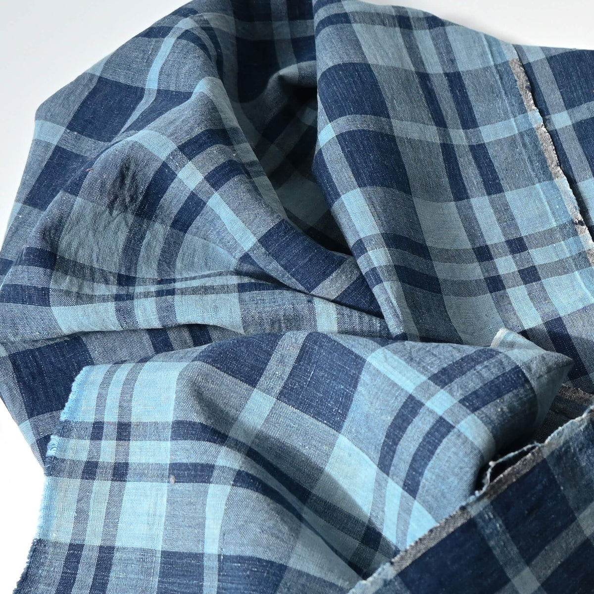 Close-up view of vintage Japanese indigo cotton piece from a futon cover with a large check woven pattern.