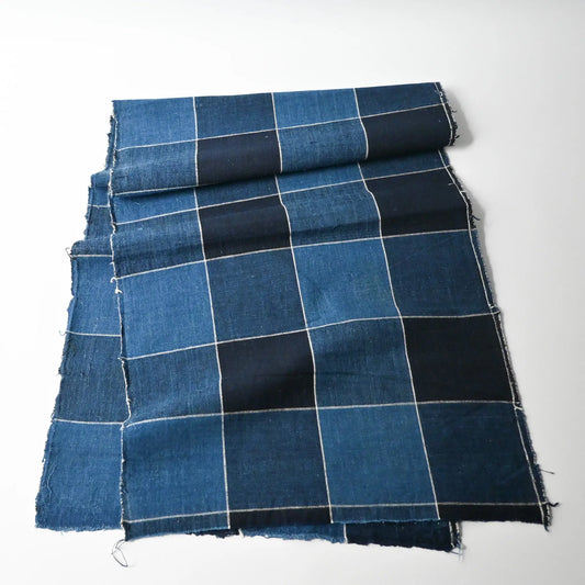 Full view of vintage Japanese indigo check cotton futon cover panel with a bold grid pattern.