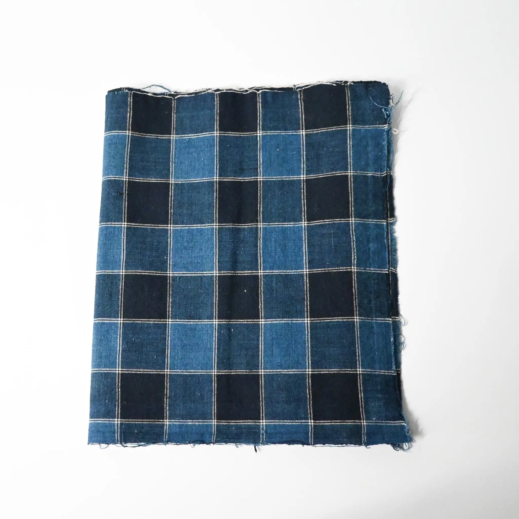 Vintage Japanese indigo check cotton futon cover panel with a bold grid pattern in deep and mid-tone blues.