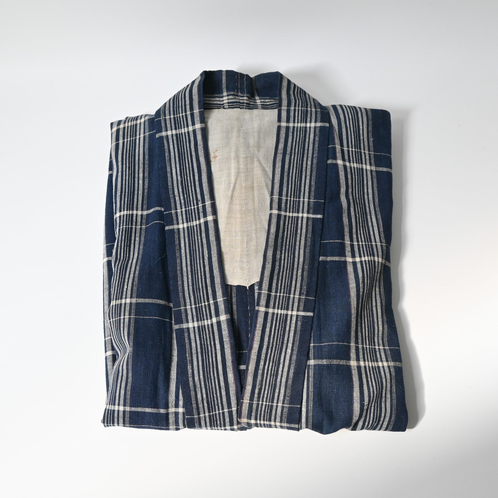 Vintage indigo check cotton Noragi, farmer's jacket from the mid-20th century.