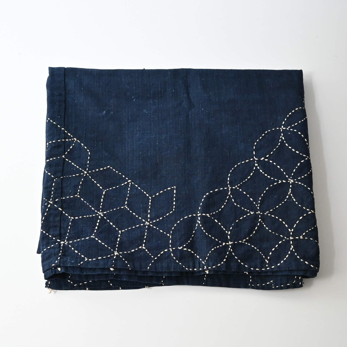 Vintage indigo cotton furoshiki with reinforced traditional Japanese sashiko stitch around the  corners.