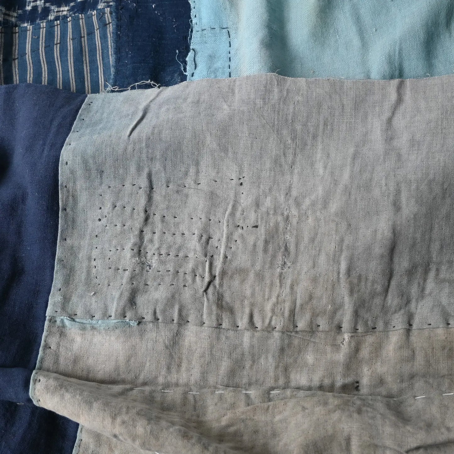 Detailed view of vintage futon cover made from a mix of various cottons recycled from kimono and kimono linings.