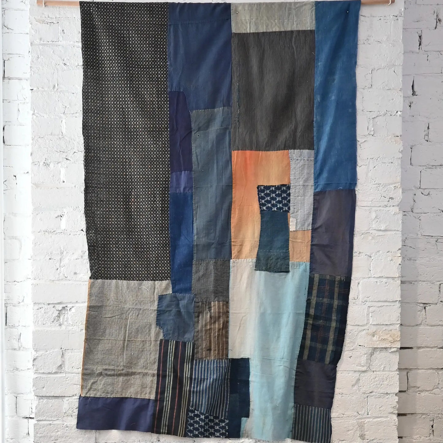 Full view of vintage futon cover made from a mix of various cottons recycled from kimono and kimono linings.