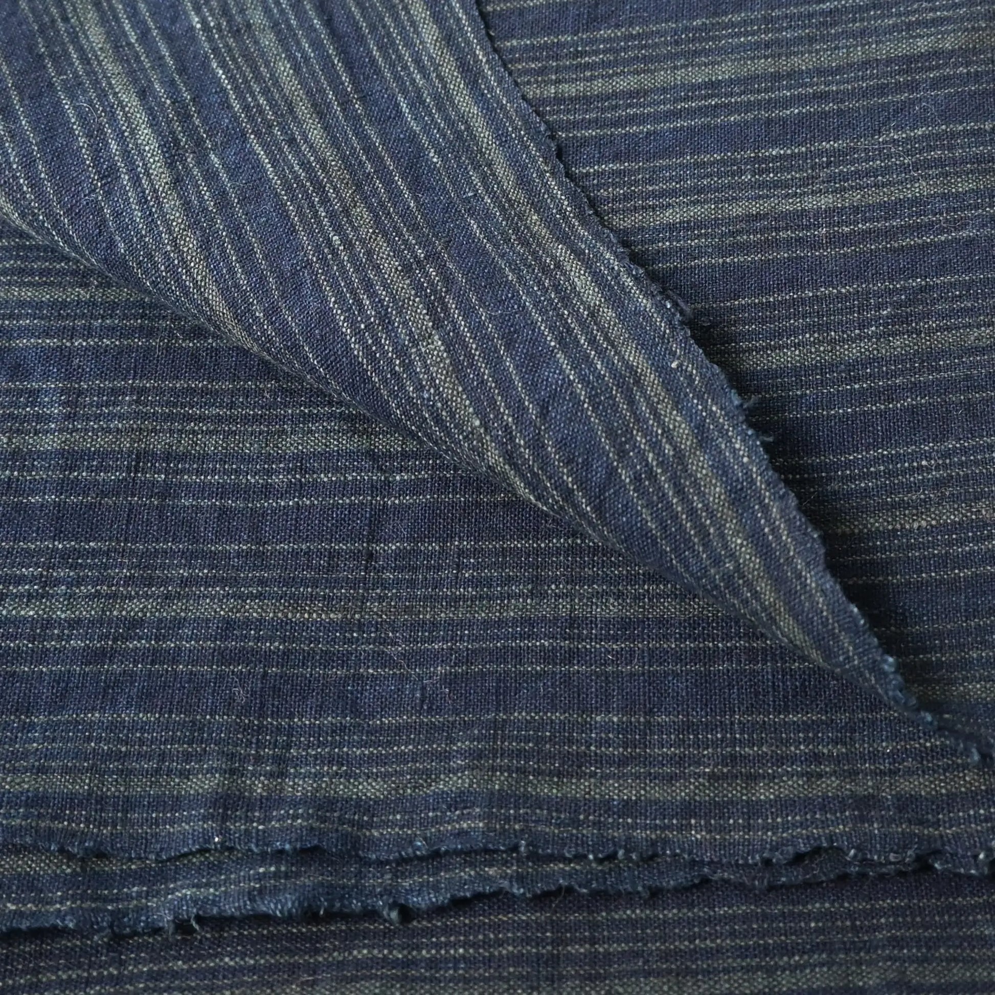 Close-up view of vintage Japanese indigo stripe cotton large furoshiki from the mid-20th century.