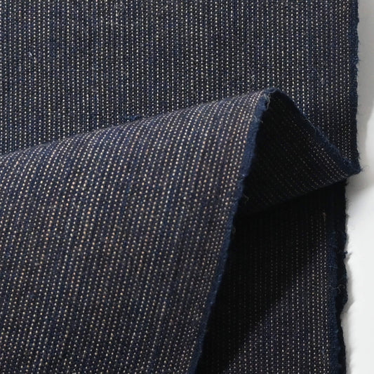 Close-up view of vintage Japanese indigo fine stripe cotton piece, medium to heavy weight.