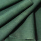 close-up view of vintage Japanese dead stock indigo green futon cover fabric bolt from early to mid 20th C, sold by the metre.
