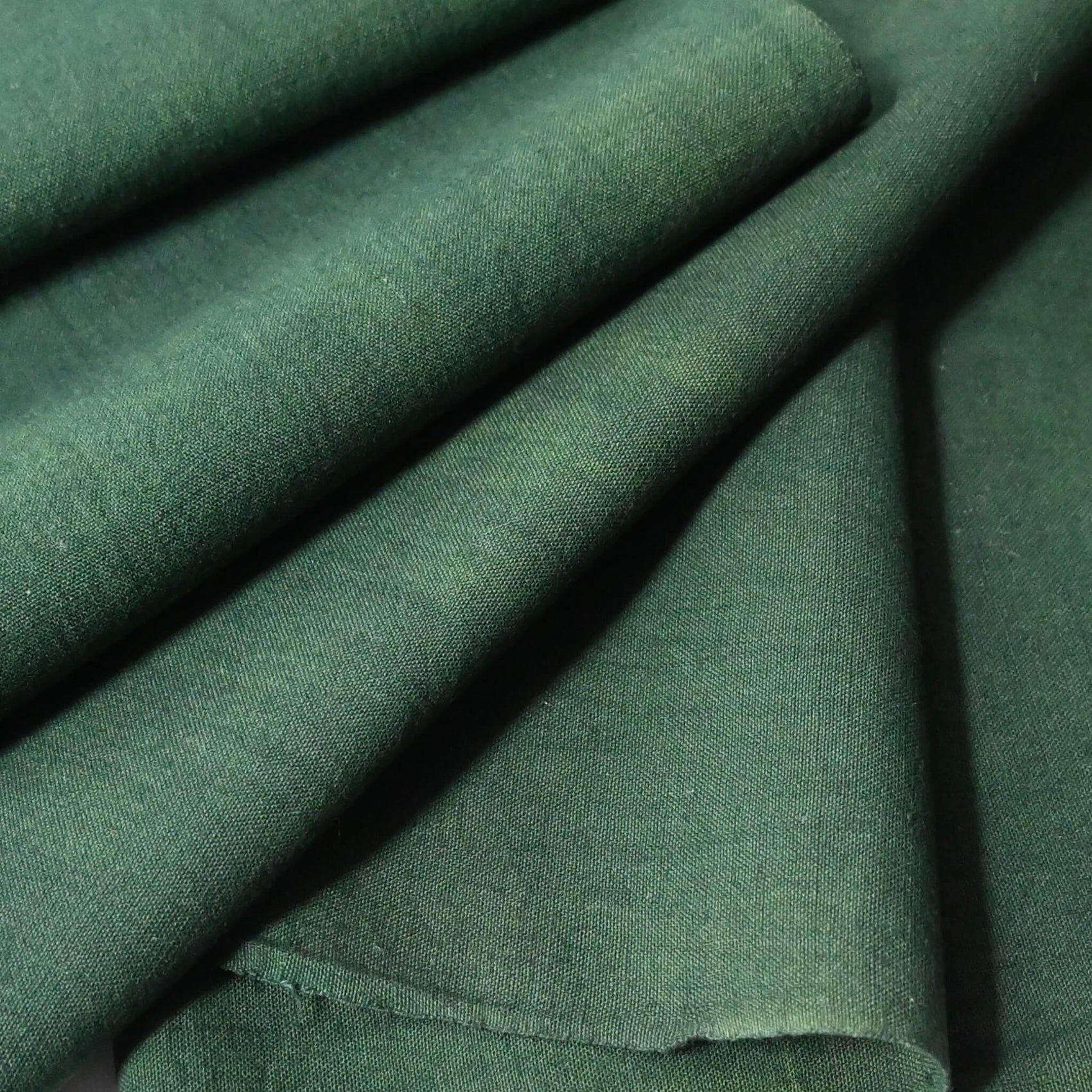 close-up view of vintage Japanese dead stock indigo green futon cover fabric bolt from early to mid 20th C, sold by the metre.