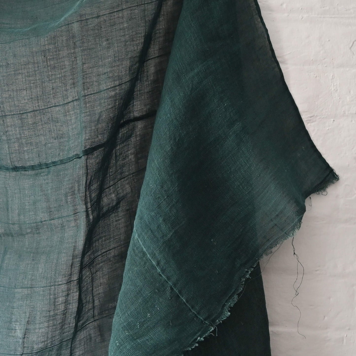 Detailed view of vintage Japanese indigo green hemp piece, originally Kaya mosquito net.