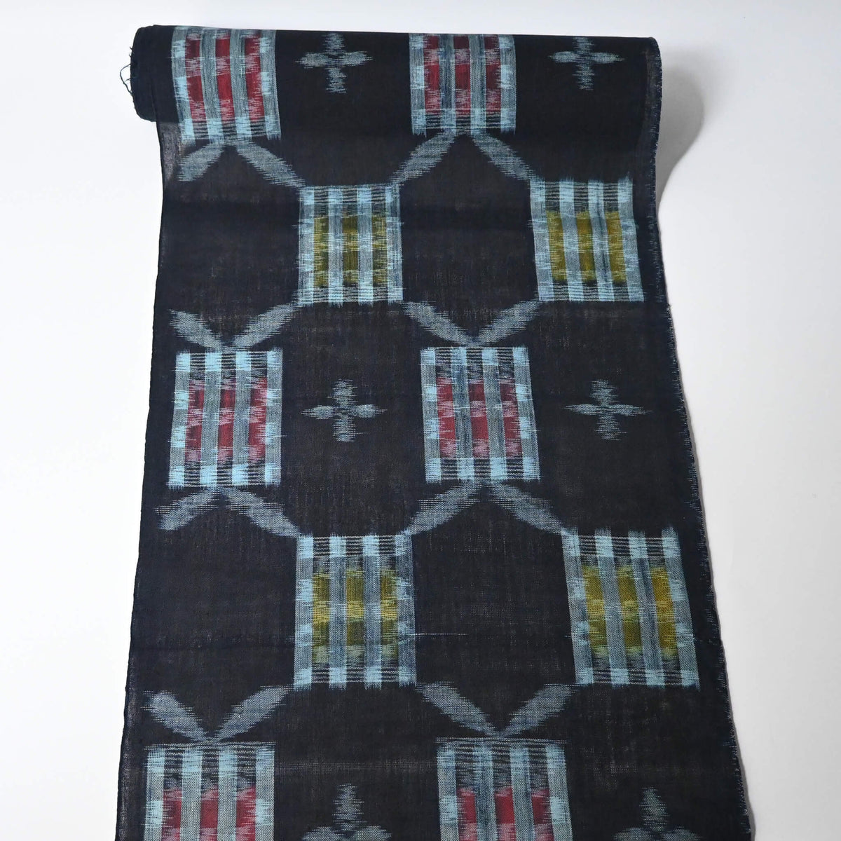 Full view of vintage Japanese Bingo kasuri cotton kimono fabric roll sold by the metre.