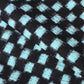 Close-up view of vintage Japanese indigo classic kasuri check cotton sold by the metre.