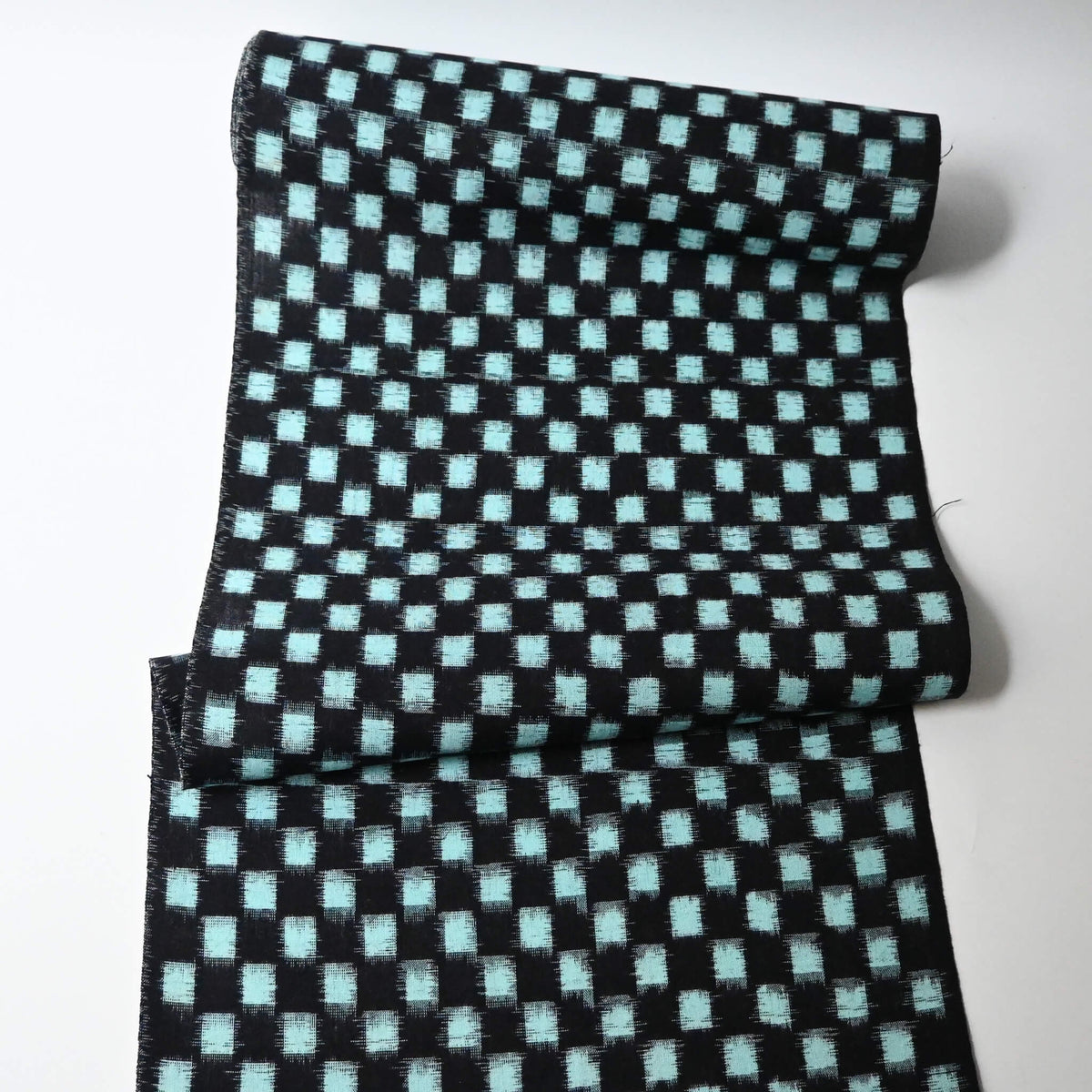 Full view of vintage Japanese indigo classic kasuri check cotton sold by the metre.