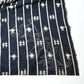 Detailed view of vintage three-panel indigo kasuri cotton furoshiki with hand stitched botanical motifs on the corner.