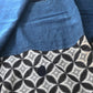 Detailed view of vintage Japanese indigo cotton Koshimaki, a traditional waist wrap, with Kasuri Shippō-tsunagi motif.