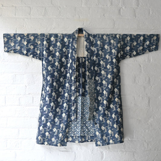 Vintage indigo kasuri cotton Noragi kimono, farmer's jacket, from the early to mid-20th century.