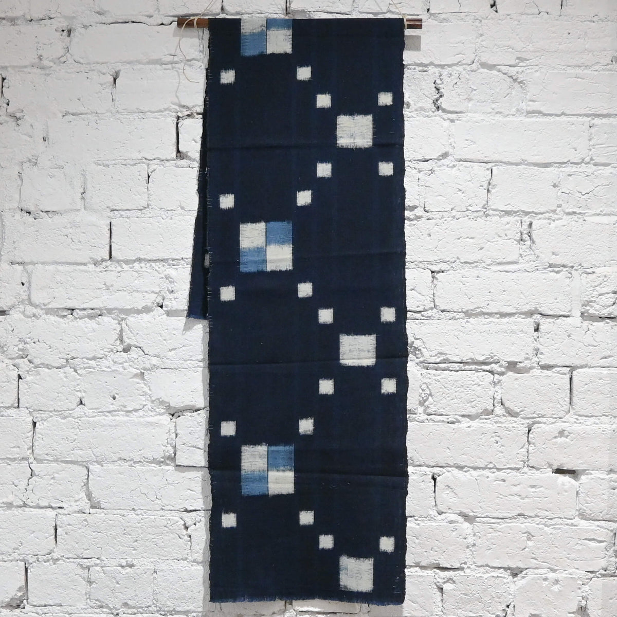 Full view of vintage Japanese indigo kasuri cotton panel from San'in region, a simple geometric pattern.