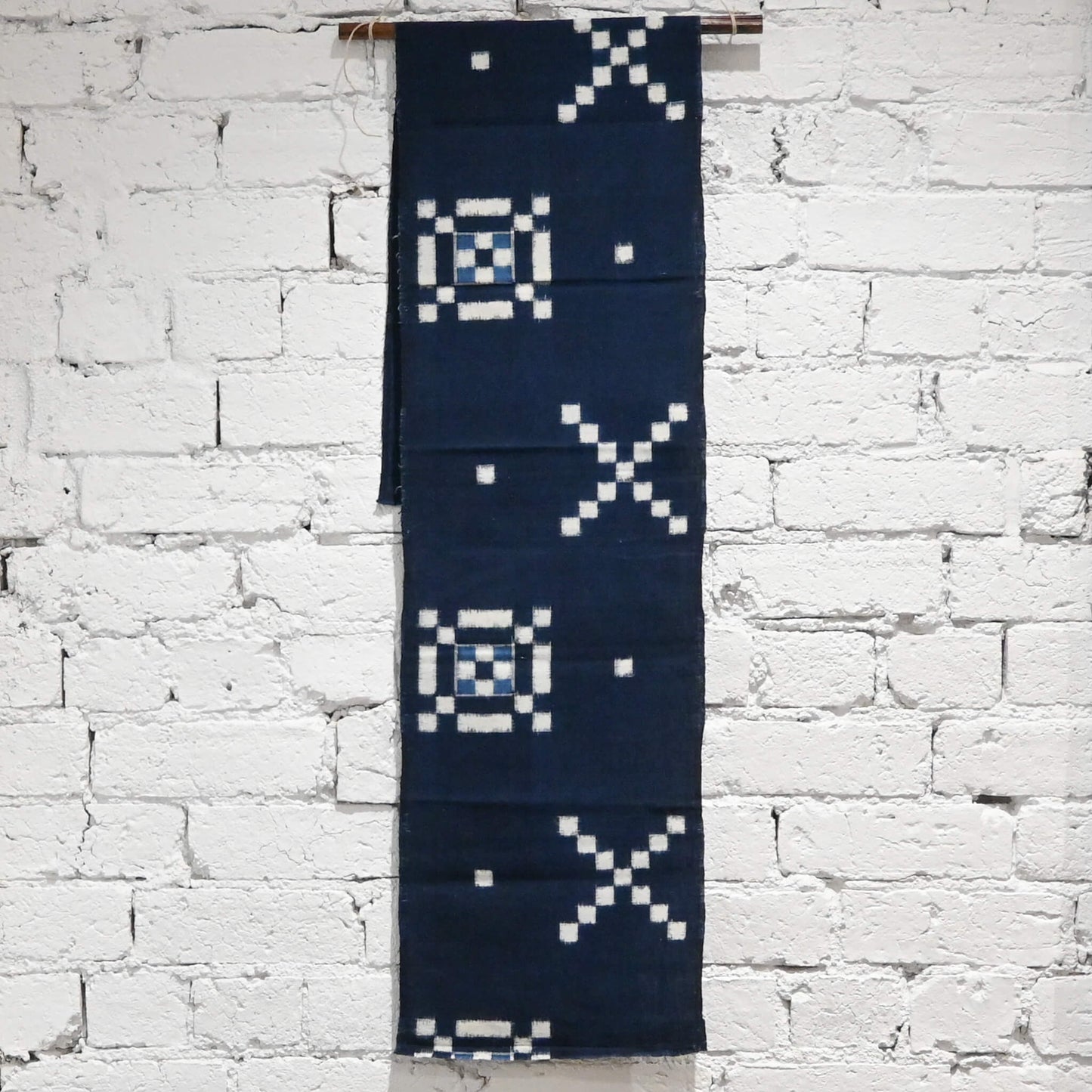 Vintage Japanese indigo kasuri cotton panel from San'in region, a simple geometric pattern.