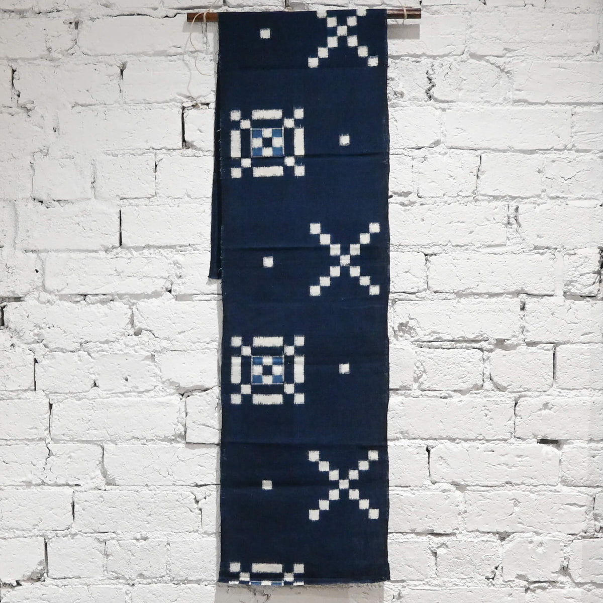 Vintage Japanese indigo kasuri cotton panel from San'in region, a simple geometric pattern.