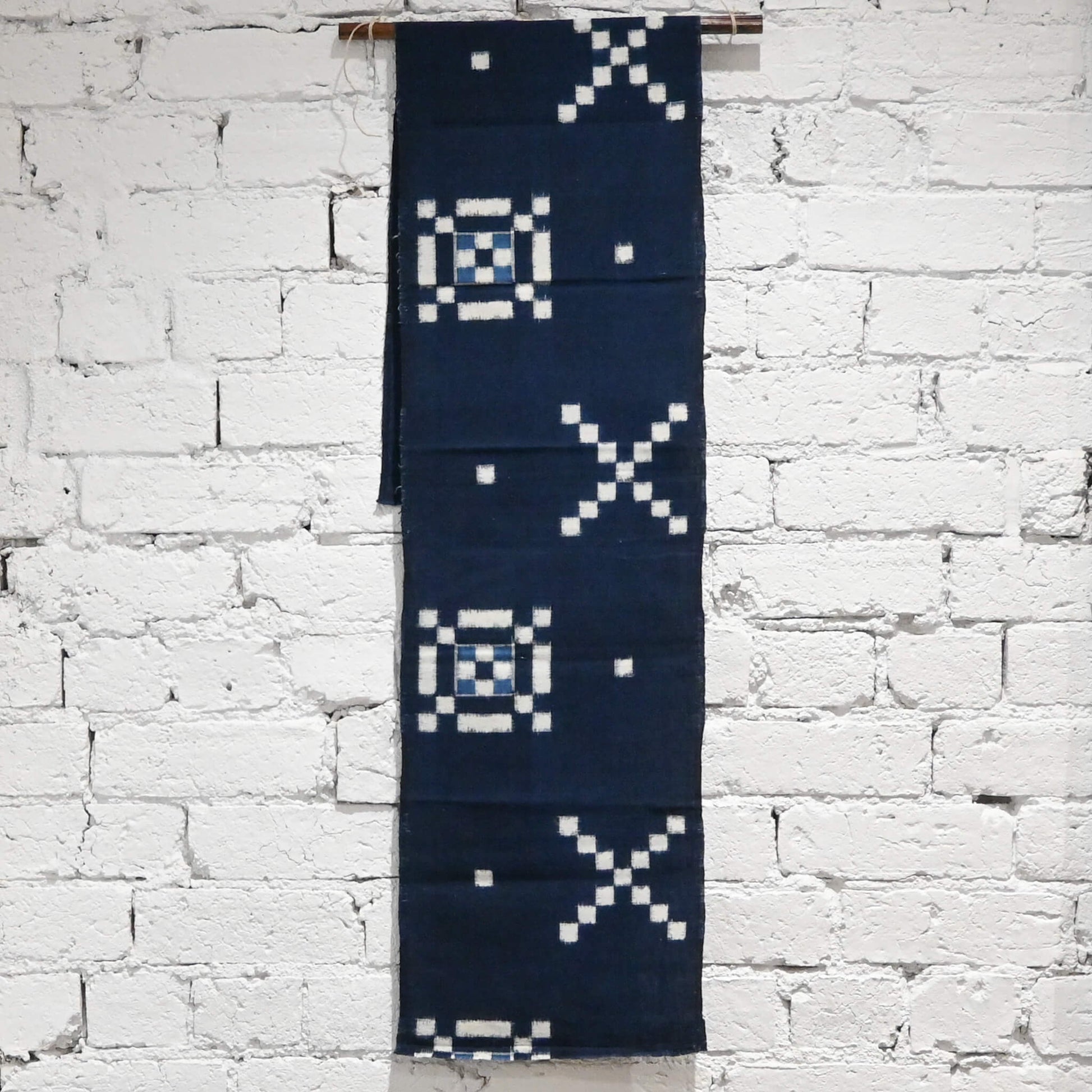 Vintage Japanese indigo kasuri cotton panel from San'in region, a simple geometric pattern.